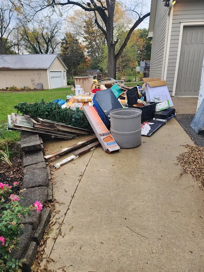 Dumpster being loaded with debris for 30 Yard Dumpster Rental in Steiner Ranch